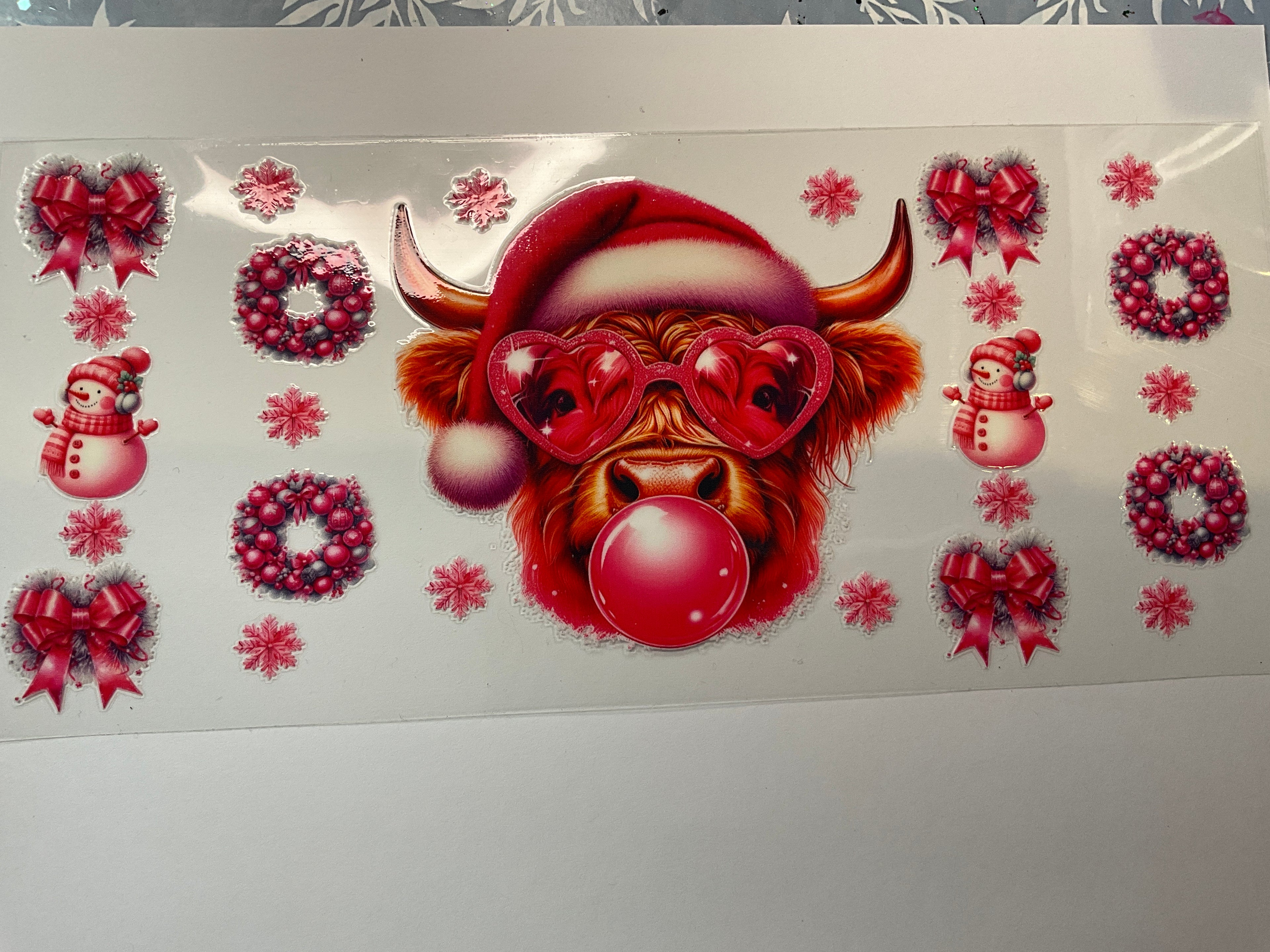 Christmas cow blowing bubble