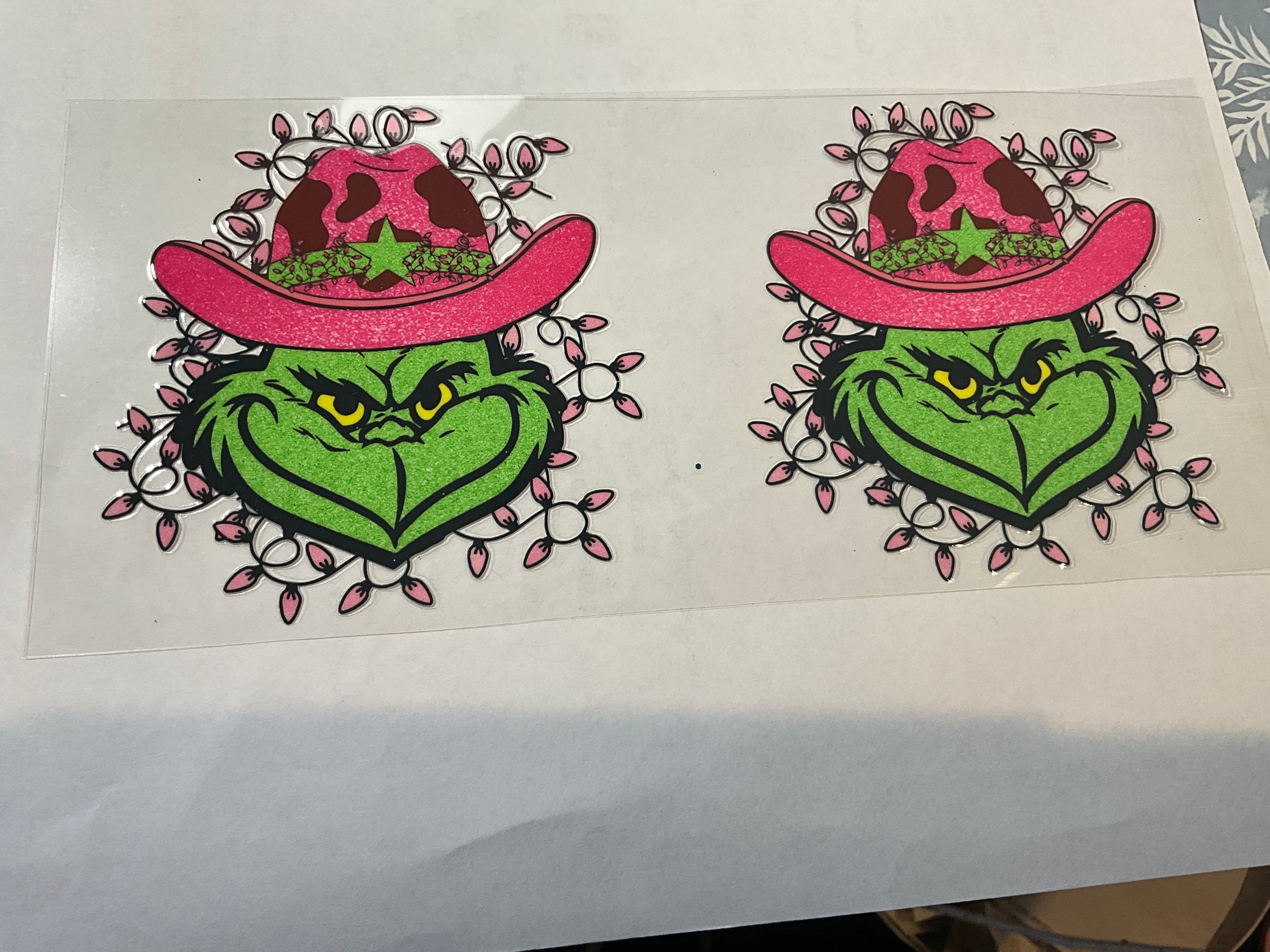 Green man with pink cowboy hat