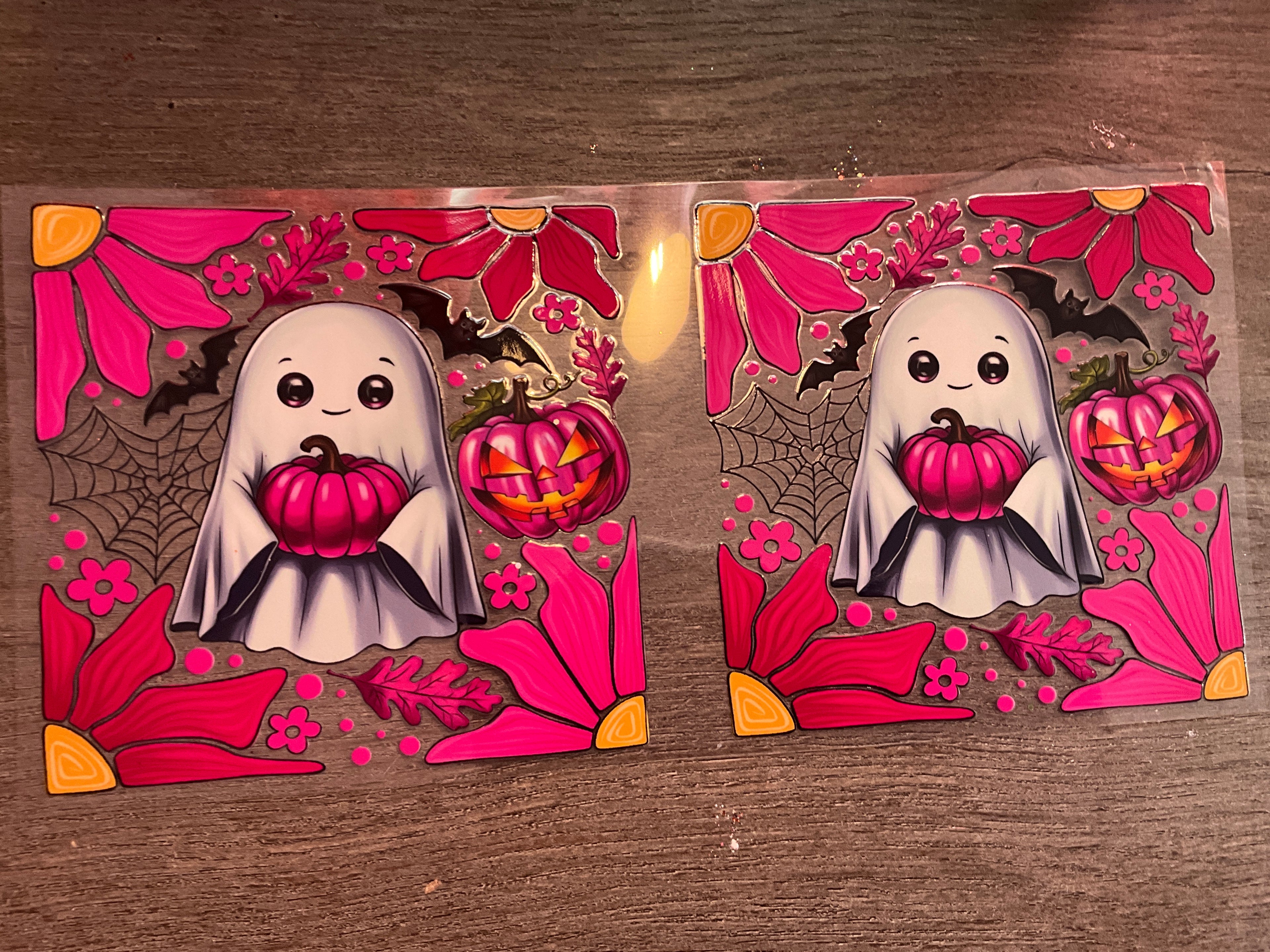 Ghost holding pink pumpkin