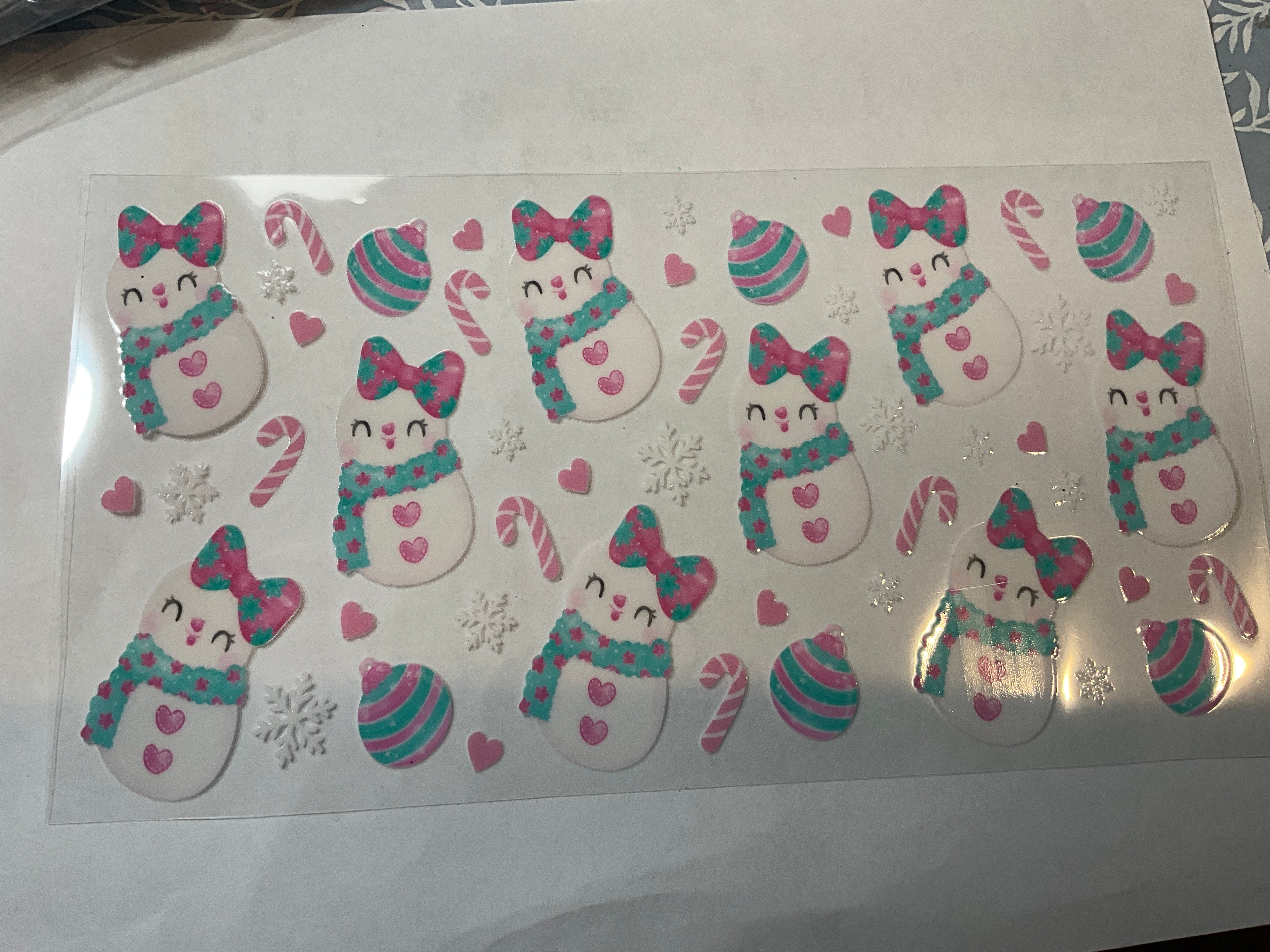 Pink and blue snowman with bows
